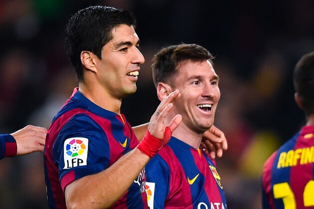 BARCELONA, SPAIN - DECEMBER 20:  Lionel Messi of FC Barcelona celebrates with his teammate Luis Suarez of FC Barcelona after scoring his team's fifth goal during the La Liga match between FC Barcelona and Cordoba CF at Camp Nou on December 20, 2014 in Barcelona, Spain.  (Photo by David Ramos/Getty Images)