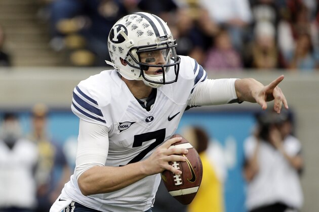BYU quarterback Christian Stewart directs his team during the first half of an NCAA college football game against California, Saturday, Nov. 29, 2014, in Berkeley, Calif. (AP Photo/Marcio Jose Sanchez)