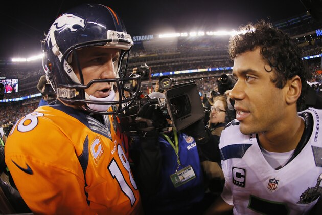 EAST RUTHERFORD, NJ - FEBRUARY 02:  (L-R) Quarterback Peyton Manning #18 of the Denver Broncos congratulates quarterback Russell Wilson #3 of the Seattle Seahawks on their 43-8 win during Super Bowl XLVIII at MetLife Stadium on February 2, 2014 in East Rutherford, New Jersey.  (Photo by Kevin C. Cox/Getty Images)