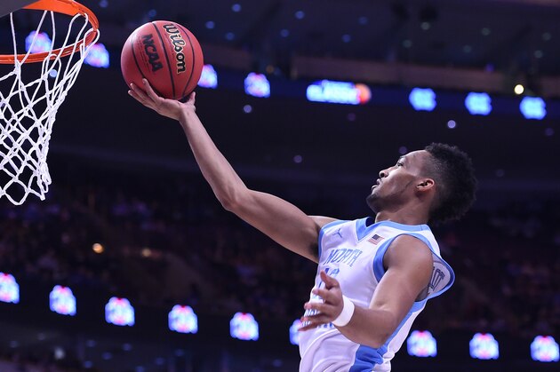 Dec 20, 2014; Chicago, IL, USA; North Carolina Tar Heels forward J.P. Tokoto (13) shoots the ball against the Ohio State Buckeyes during the first half at United Center. Mandatory Credit: Mike DiNovo-USA TODAY Sports
