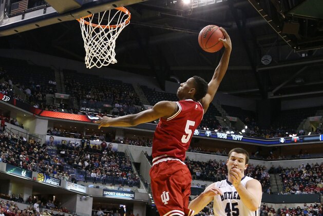 Dec 20, 2014; Indianapolis, IN, USA; Indiana Hoosiers forward Troy Williams (5) dunks against Butler Bulldogs forward Andrew Chrabascz (45) at Bankers Life Fieldhouse. Indiana defeats Butler 82-73. Mandatory Credit: Brian Spurlock-USA TODAY Sports