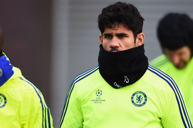 LONDON, ENGLAND - DECEMBER 09:  (L-R) Ramires, Diego Costa and Petr Cech attempt to keep warm during a Chelsea training session, ahead of the UEFA Champions League Group G match, against Sporting Clube de Portugal at Cobham Training Centre on December 9, 2014 in London, United Kingdom.  (Photo by Paul Gilham/Getty Images)