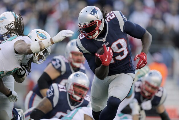 New England Patriots running back LeGarrette Blount (29) runs for a touchdown against the Miami Dolphins in the second half of an NFL football game Sunday, Dec. 14, 2014, in Foxborough, Mass. (AP Photo/Charles Krupa)