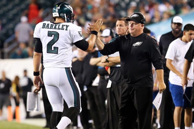 Aug 21, 2014; Philadelphia, PA, USA; Philadelphia Eagles head coach Chip Kelly high fives quarterback Matt Barkley (2) as he walks off the field during the second half of a game against the Pittsburgh Steelers at Lincoln Financial Field. The Eagles won 31-21. Mandatory Credit: Bill Streicher-USA TODAY Sports