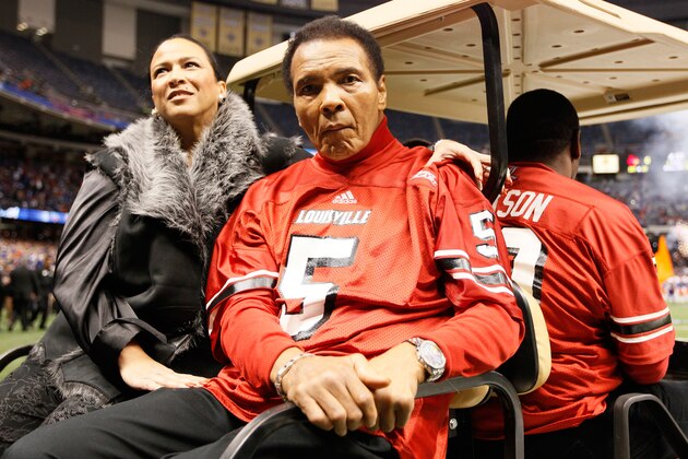 NEW ORLEANS, LA - JANUARY 02:  Boxing legend Muhammad Ali and his wife Lonnie Ali ride a golf cart onto the field to represent the Louisville Cardinals for the coin toss against the Florida Gators prior to the start of the Allstate Sugar Bowl at Mercedes-Benz Superdome on January 2, 2013 in New Orleans, Louisiana.  (Photo by Kevin C. Cox/Getty Images)