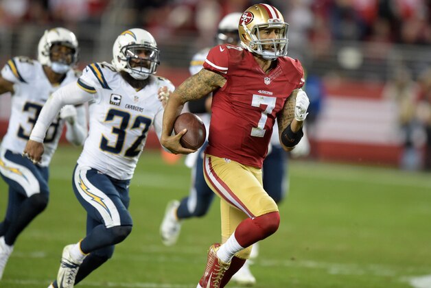 Dec 20, 2014; Santa Clara, CA, USA; San Francisco 49ers quarterback Colin Kaepernick (7) is pursued by San Diego Chargers safety Eric Weddle (32) on a 94-yard touchdown run in the third quarter at Levi's Stadium. Mandatory Credit: Kirby Lee-USA TODAY Sports