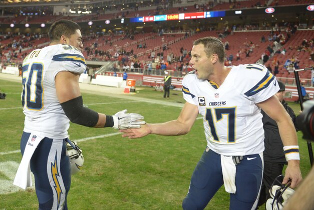 Dec 20, 2014; Santa Clara, CA, USA; San Diego Chargers inside linebacker Manti Te'o (50) and quarterback Philip Rivers (17) celebrate after the game against the San Francisco 49ers at Levi's Stadium. The Chargers defeated the 49ers 38-35 in overtime.  Mandatory Credit: Kirby Lee-USA TODAY Sports