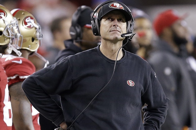 San Francisco 49ers coach Jim Harbaugh stands on the sideline during the third quarter of an NFL football game against the San Diego Chargers in Santa Clara, Calif., Saturday, Dec. 20, 2014. (AP Photo/Ben Margot)