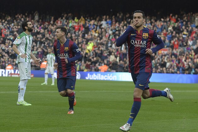 FC Barcelona's Pedro Rodriguez, right, reacts after scoring against Cordoba during a Spanish La Liga soccer match at the Camp Nou stadium in Barcelona, Spain, Saturday, Dec. 20, 2014. (AP Photo/Manu Fernandez)