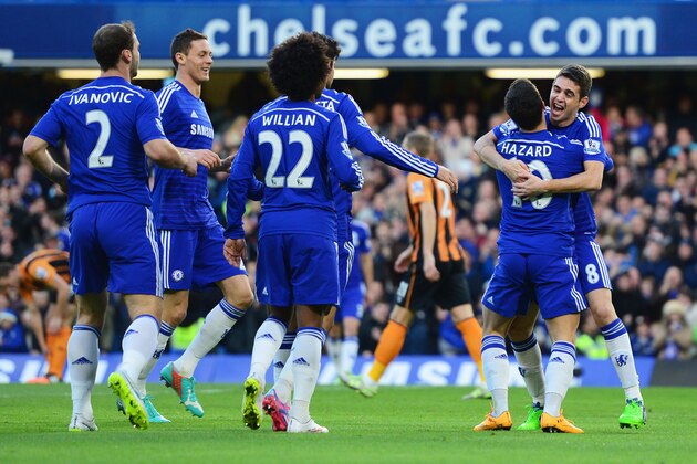 LONDON, ENGLAND - DECEMBER 13:  Eden Hazard of Chelsea (10) celebrates with Oscar and team mates as he scores their first goal  during the Barclays Premier League match between Chelsea and Hull City at Stamford Bridge on December 13, 2014 in London, England.  (Photo by Jamie McDonald/Getty Images)