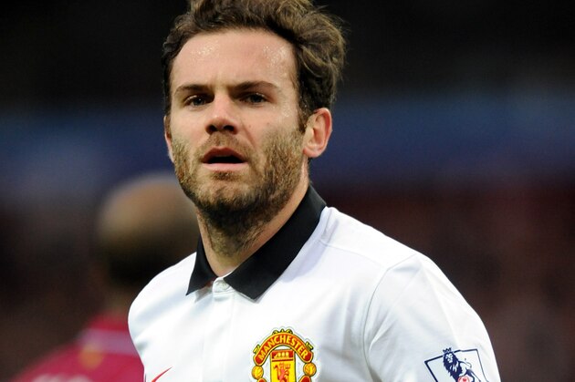 Manchester United's Juan Mata during the English Premier League soccer match between Aston Villa and Manchester United at Villa Park, in  Birmingham, England, Saturday, Dec. 20, 2014.  (AP Photo/Rui Vieira)