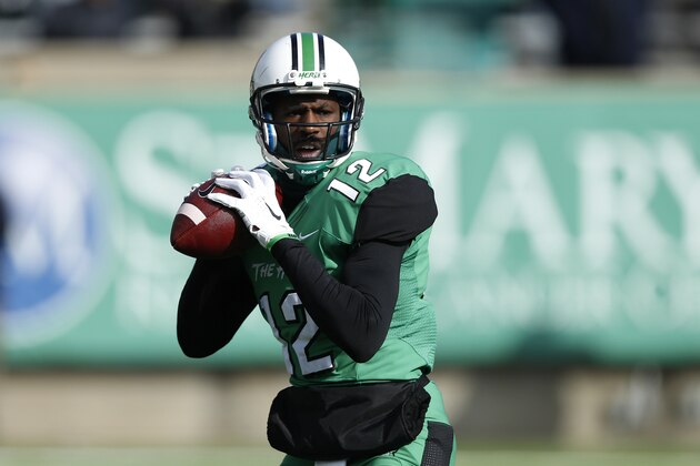 HUNTINGTON, WV - NOVEMBER 28: Rakeem Cato #12 of the Marshall Thundering Herd looks to pass in the first half of the game against the Western Kentucky Hilltoppers at Joan C. Edwards Stadium on November 28, 2014 in Huntington, West Virginia. (Photo by Joe Robbins/Getty Images)