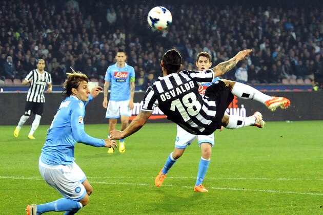 Juventus striker Osvaldo is airborne as he reaches for the ball, during a Serie A soccer match between Napoli and Juventus, at the San Paolo stadium in Naples, Italy, Sunday, March, 30, 2014. (AP Photo/Salvatore Laporta)