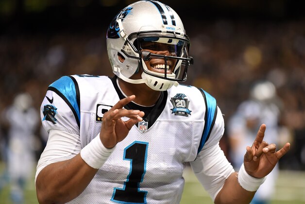 NEW ORLEANS, LA - DECEMBER 07:   Cam Newton #1 of the Carolina Panthers celebrates after throwing a touchdown pass early in the second quarter against the New Orleans Saints  at Mercedes-Benz Superdome on December 7, 2014 in New Orleans, Louisiana.  (Photo by Stacy Revere/Getty Images)