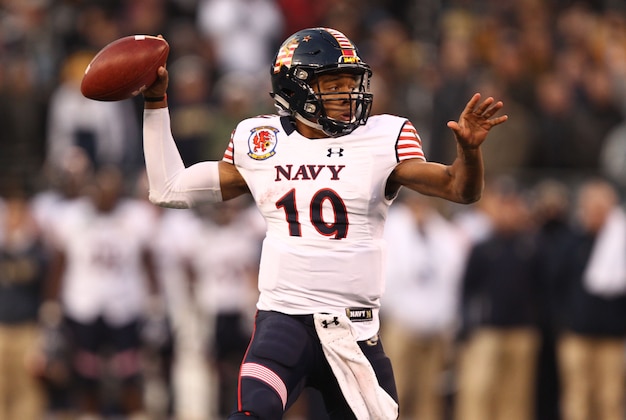 Dec 13, 2014; Baltimore, MD, USA; Navy Midshipmen quarterback Keenan Reynolds (19) throws a touchdown pass during the first half against the Army Black Knights at M&T Bank Stadium. Mandatory Credit: Danny Wild-USA TODAY Sports