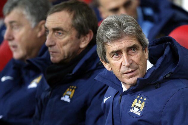 Manchester City's manager Manuel Pellegrini awaits the start of the match ahead of their English Premier League soccer game against Sunderland at the Stadium of Light, Sunderland, England, Wednesday, Dec. 3, 2014. (AP Photo/Scott Heppell)