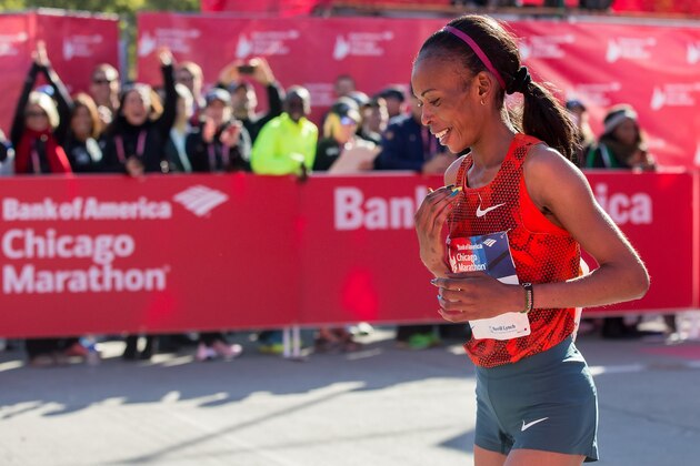 FILE - In this Sunday, Oct. 12, 2014 file photo, Rita Jeptoo of Kenya reacts after crossing the finish line to win the women's race during the Chicago Marathon, in Chicago, Illinois. The agent for Chicago Marathon champion Rita Jeptoo said Friday, Oct. 31, 2014 that the Kenyan runner has failed a doping test. (AP Photo/Andrew A. Nelles, File)