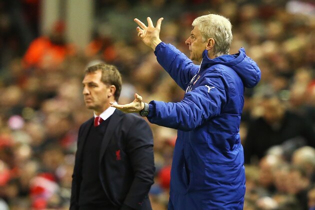 LIVERPOOL, ENGLAND - DECEMBER 21: Arsene Wenger, manager of Arsenal gestures with Brendan Rodgers, manager of Liverpool during the Barclays Premier League match between Liverpool and Arsenal at Anfield on December 21, 2014 in Liverpool, England.  (Photo by Alex Livesey/Getty Images)