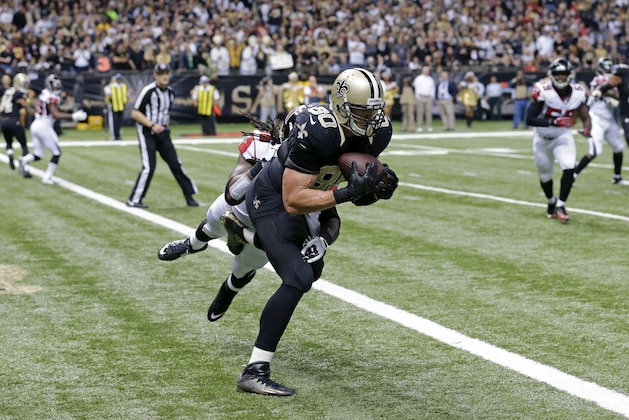New Orleans Saints tight end Jimmy Graham (80) pulls in a touchdown reception in the second half of an NFL football game against the Atlanta Falcons in New Orleans, Sunday, Dec. 21, 2014. (AP Photo/Bill Haber)