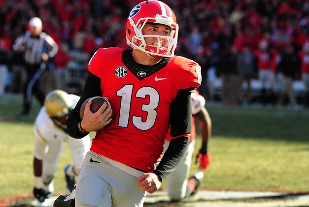 ATHENS, GA - NOVEMBER 29: Marshall Morgan #13 of the Georgia Bulldogs runs with a fake field goal against the Georgia Tech Yellow Jackets at Sanford Stadium on November 29, 2014 in Athens, Georgia. (Photo by Scott Cunningham/Getty Images)