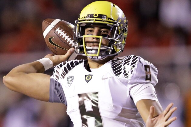 Oregon quarterback Marcus Mariota (8) passes the ball in the second half during an NCAA college football game against Utah Saturday, Nov. 8, 2014, in Salt Lake City. (AP Photo/Rick Bowmer)