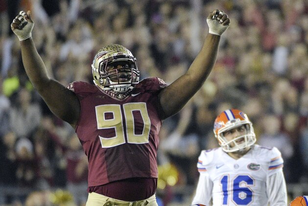 Florida State defensive tackle Eddie Goldman (90) celebrates after Florida place kicker Austin Hardin (16) missed a field goal attempt during the fourth quarter of an NCAA college football game in Tallahassee, Fla., Saturday, Nov. 29, 2014. Florida State won 24-19. (AP Photo/Phelan M. Ebenhack)