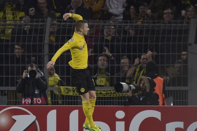 Dortmund's Marco Reus celebrates after scoring the opening goal during the Champions League group D soccer match between Borussia Dortmund and Galatasaray Istanbul in Dortmund, Germany, Tuesday, Nov.4,,2014. (AP Photo/Martin Meissner)