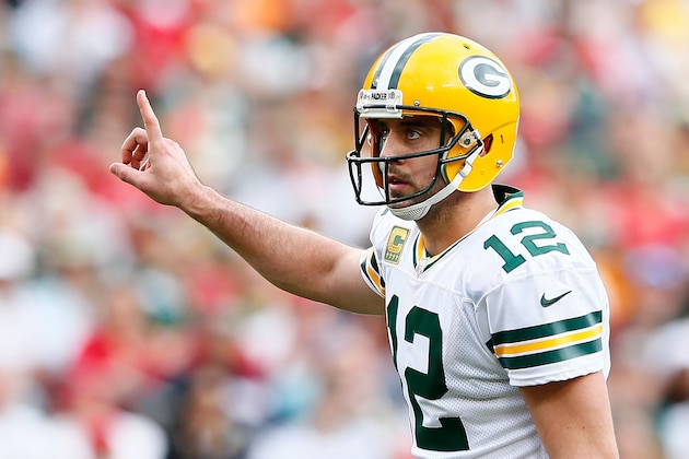 TAMPA, FL - DECEMBER 21:  Aaron Rodgers #12 of the Green Bay Packers signals to his offense during the game against the Tampa Bay Buccaneers at Raymond James Stadium on December 21, 2014 in Tampa, Florida.  (Photo by Kevin C. Cox/Getty Images)
