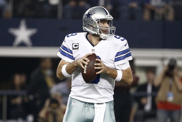 Dallas Cowboys quarterback Tony Romo (9) drops back to pass during the first half of an NFL football game against the Indianapolis Colts, Sunday, Dec. 21, 2014, in Arlington, Texas. (AP Photo/Brandon Wade)