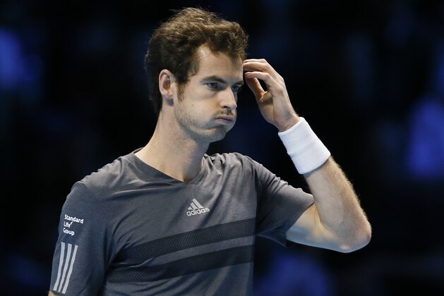 Britain’s Andy Murray reacts during his singles ATP World Tour tennis finals match against Switzerland’s Roger Federer at the O2 arena in London, Thursday, Nov. 13, 2014. (AP Photo/Kirsty Wigglesworth)