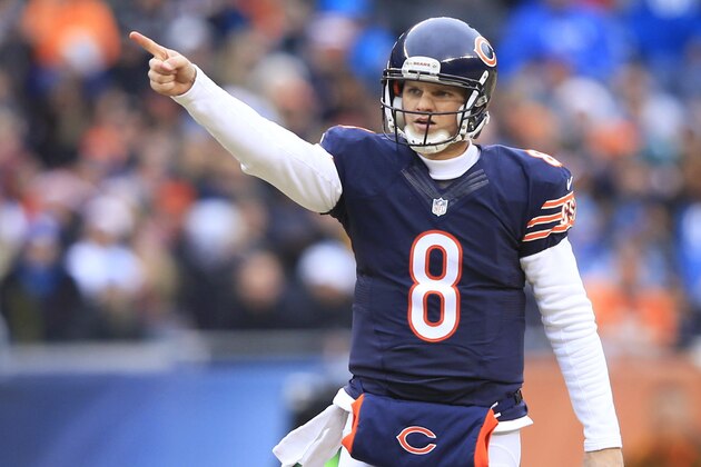 CHICAGO, IL - DECEMBER 21: Jimmy Clausen #8 of the Chicago Bears motions after getting a first down during the first quarter at Soldier Field on December 21, 2014 in Chicago, Illinois. (Photo by Jamie Squire/Getty Images)