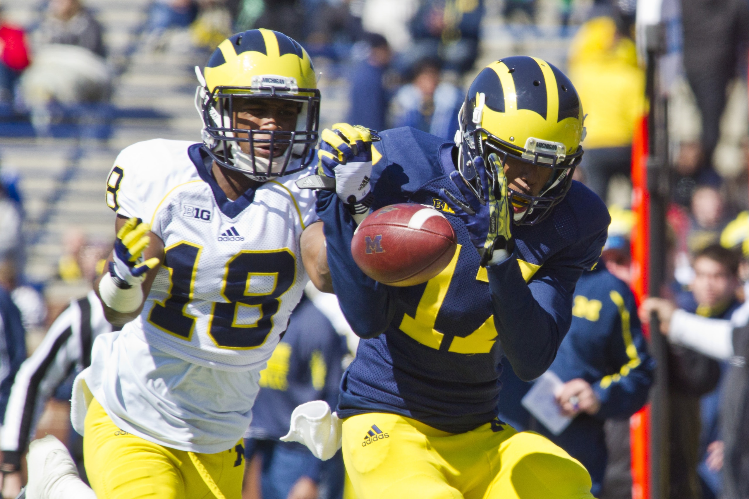 Michigan defensive back Blake Countess (18) breaks up a pass intended for wide receiver Freddy Canteen (17), during the football team's annual spring game, Saturday, April 5, 2014, in Ann Arbor, Mich. (AP Photo/Tony Ding)