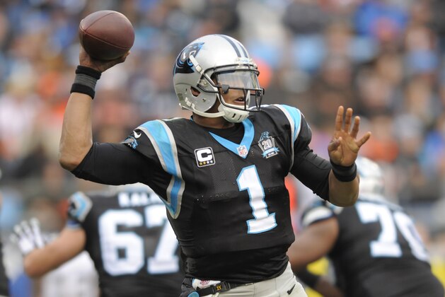 Carolina Panthers' Cam Newton (1) looks to pass against the Cleveland Browns in the second half of an NFL football game in Charlotte, N.C., Sunday, Dec. 21, 2014. (AP Photo/Mike McCarn)