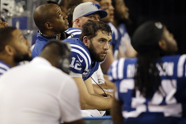 Indianapolis Colts quarterback Andrew Luck (12) looks on from the sidelines during the second half of an NFL football game against the Dallas Cowboys, Sunday, Dec. 21, 2014, in Arlington, Texas. Dallas won 42-7. (AP Photo/Tim Sharp)