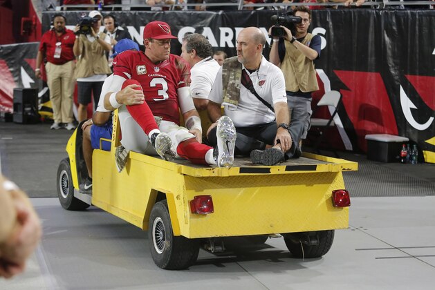 Arizona Cardinals quarterback Carson Palmer (3) leaves the game after being injured against the St. Louis Rams during the second half of an NFL football game, Sunday, Nov. 9, 2014, in Glendale, Ariz. (AP Photo/Rick Scuteri)