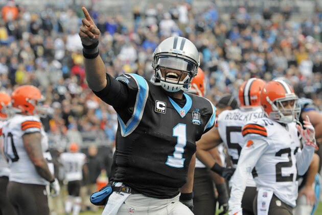 Carolina Panthers' Cam Newton (1) celebrates after running for a touchdown against the Cleveland Browns in the first half of an NFL football game in Charlotte, N.C., Sunday, Dec. 21, 2014. (AP Photo/Mike McCarn)