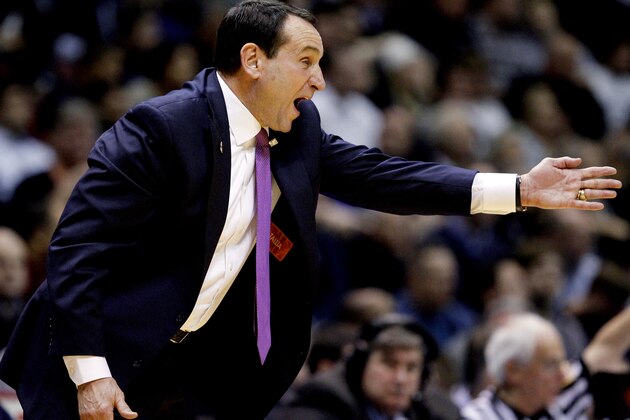 Duke head coach Mike Krzyzewski talks to his team during the second half of an NCAA college basketball game against Connecticut, Thursday, Dec. 18, 2014, in East Rutherford, N.J. Duke won 66-56. (AP Photo/Julio Cortez)