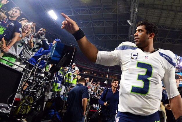 Dec 21, 2014; Glendale, AZ, USA; Seattle Seahawks quarterback Russell Wilson (3) after the second half against the Arizona Cardinals at University of Phoenix Stadium. The Seahawks won 35-6. Mandatory Credit: Joe Camporeale-USA TODAY Sports