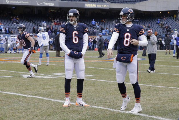 Chicago Bears quarterbacks Jay Cutler (6) and Jimmy Clausen (8) warm up before an NFL football game against the Detroit Lions Sunday, Dec. 21, 2014, in Chicago. (AP Photo/Nam Y. Huh)