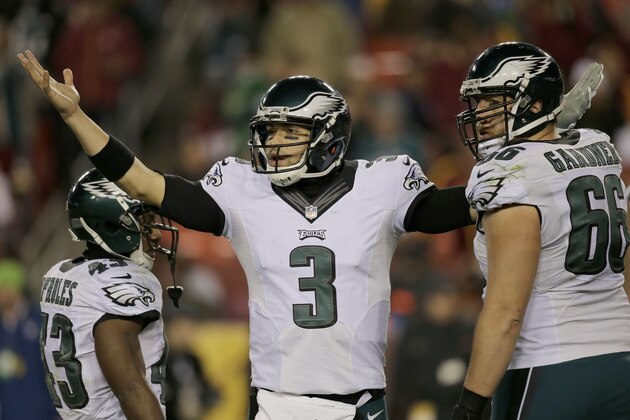 Philadelphia Eagles quarterback Mark Sanchez (3) reacts back toward the bench during the second half of an NFL football game against the Washington Redskins in Landover, Md., Saturday, Dec. 20, 2014. (AP Photo/Mark Tenally)