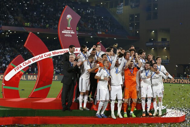 MARRAKECH, MOROCCO - DECEMBER 20: The Real Madrid CF celebrate with the FIFA Club World Cup trophy during a presentation ceremony after the FIFA Club World Cup Final match between Real Madrid CF and San Lorenzo at Le Grand Stade de Marrakech on December 20, 2014 in Marrakech, Morocco.  (Photo by Steve Bardens/Getty Images)