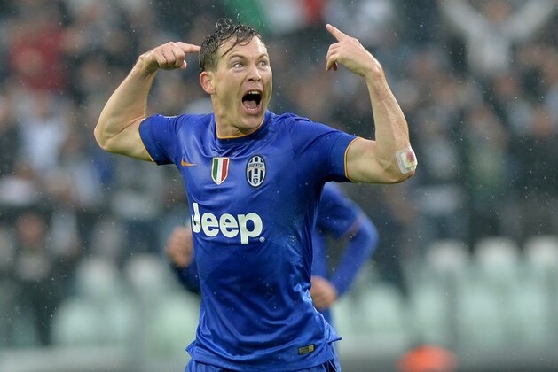 CORRECTS DATE - Juventus defender Stephan Lichtsteiner celebrates after scoring during a Serie A soccer match between Juventus and  Parma at the Juventus stadium, in Turin, Italy, Sunday, Nov. 9, 2014. (AP Photo/ Massimo Pinca)