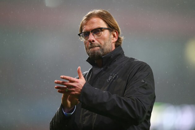 LONDON, ENGLAND - NOVEMBER 26:  Jurgen Klopp the Borussia Dortmund manager applauds the travelling fans following his team's 2-0 defeat during the UEFA Champions League Group D match between Arsenal and Borussia Dortmund at the Emirates Stadium on November 26, 2014 in London, United Kingdom.  (Photo by Clive Rose/Getty Images)