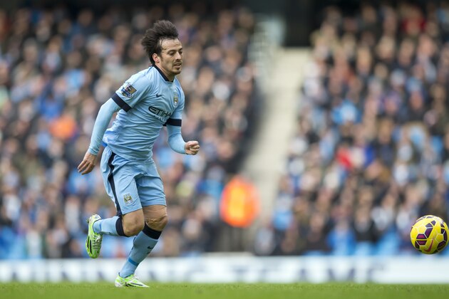 Manchester City's David Silva takes the ball downfield during his team's English Premier League soccer match between Manchester City and Crystal Palace at the Etihad Stadium, Manchester, England, Saturday Dec. 20, 2014. (AP Photo/Jon Super)