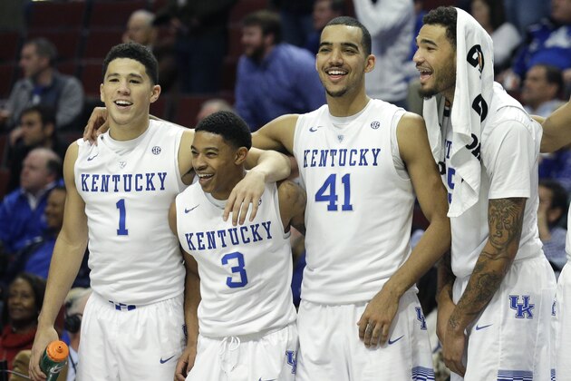 Kentucky players from left, Devin Booker, Tyler Ulis, Trey Lyles, and Willie Cauley-Stein celebrate their 83-42 win over UCLA during the second half of an NCAA college basketball game, Saturday, Dec. 20, 2014, in Chicago. (AP Photo/Nam Y. Huh)