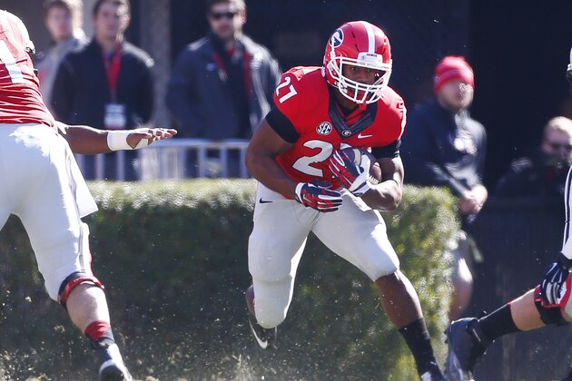 Georgia running back Nick Chubb (27) looks for running room against the Charleston Southern  in the first half of an NCAA college football game  Saturday, Nov. 22, 2014, in Athens, Ga.   (AP Photo/John Bazemore)