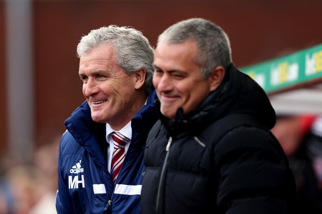 STOKE ON TRENT, ENGLAND - DECEMBER 07:  Chelsea manager Jose Mourinho shares a joke with Stoke manager Mark Hughes during the Barclays Premier League match between Stoke City and Chelsea at Britannia Stadium on December 7, 2013 in Stoke on Trent, England.  (Photo by Scott Heavey/Getty Images)