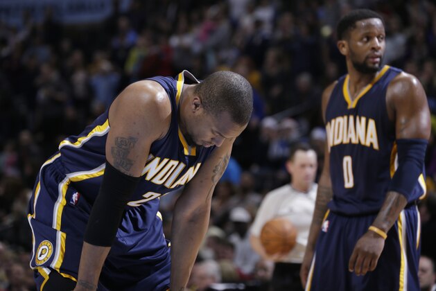 Indiana Pacers forward David West, front, and guard C.J. Miles react as time runs out against the Denver Nuggets in the fourth quarter of an NBA basketball game Saturday, Dec. 20, 2014, in Denver. The Nuggets won 76-73. (AP Photo/David Zalubowski)