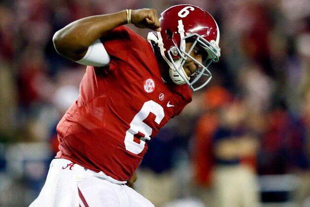 TUSCALOOSA, AL - NOVEMBER 29:  Blake Sims #6 of the Alabama Crimson Tide celebrates throwing a touchdown in the fourth quarter against the Auburn Tigers during the Iron Bowl at Bryant-Denny Stadium on November 29, 2014 in Tuscaloosa, Alabama.  (Photo by Kevin C. Cox/Getty Images)