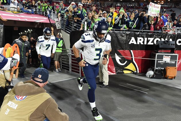 GLENDALE, AZ - DECEMBER 21:  Quarterback Russell Wilson #3 of the Seattle Seahawks takes the field for warmup prior to the NFL game against the Arizona Cardianls at University of Phoenix Stadium on December 21, 2014 in Glendale, Arizona.  (Photo by Norm Hall/Getty Images)